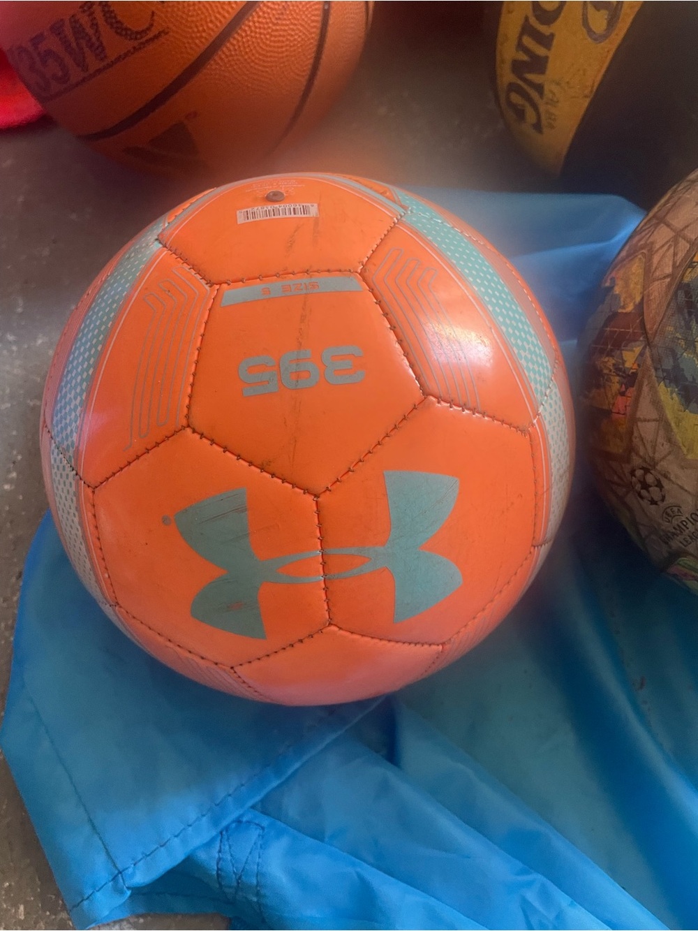Under Armour Orange Soccer Ball with Light Blue Accents